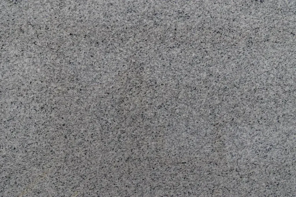 Gray speckled textured surface filling the frame