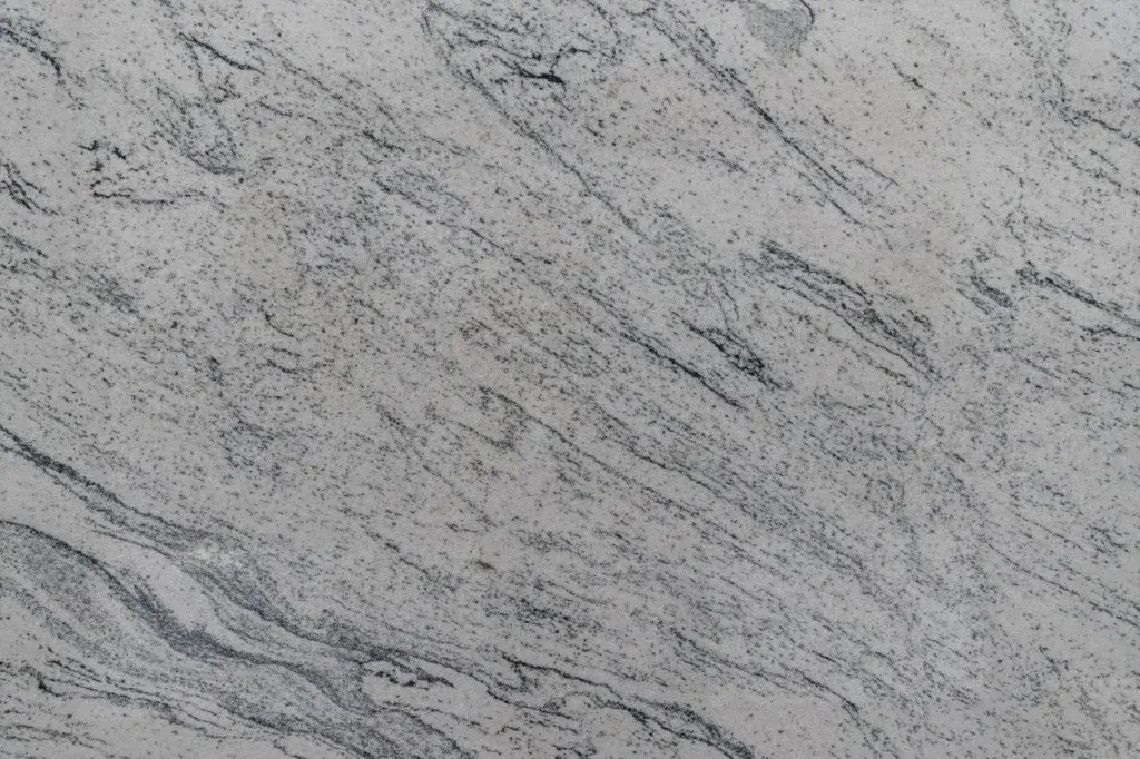 Gray marble surface with subtle dark veining and diagonal streaks