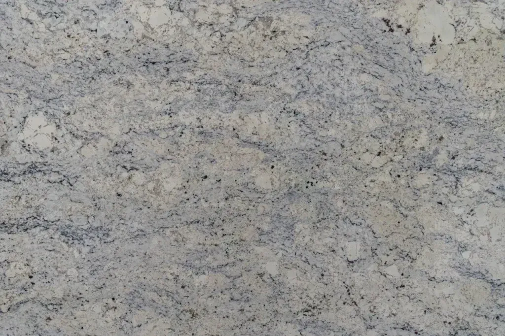 Light gray and beige speckled stone or granite surface texture