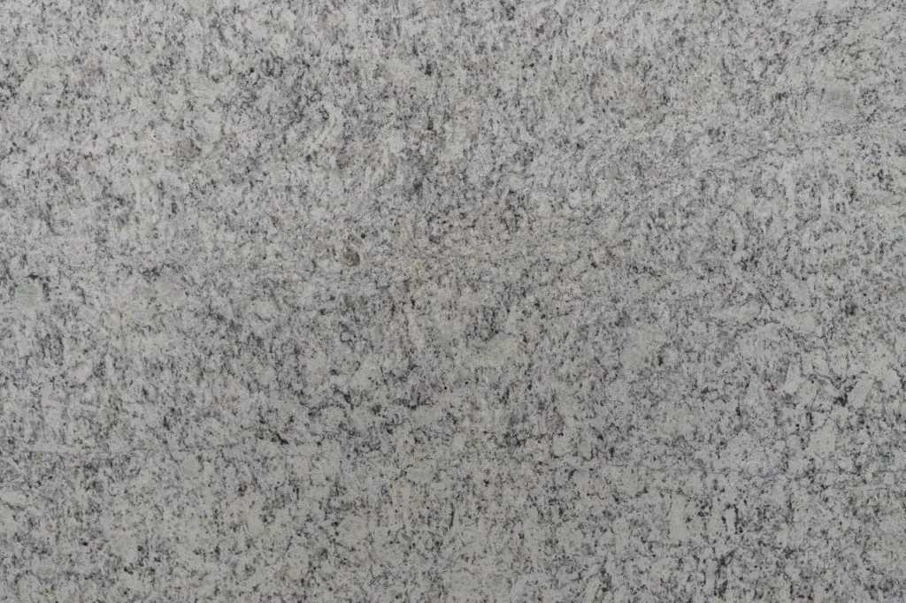Gray speckled stone or concrete surface texture