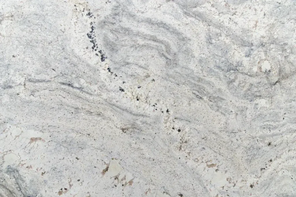 Light gray stone surface with subtle wavy marbling and scattered speckles