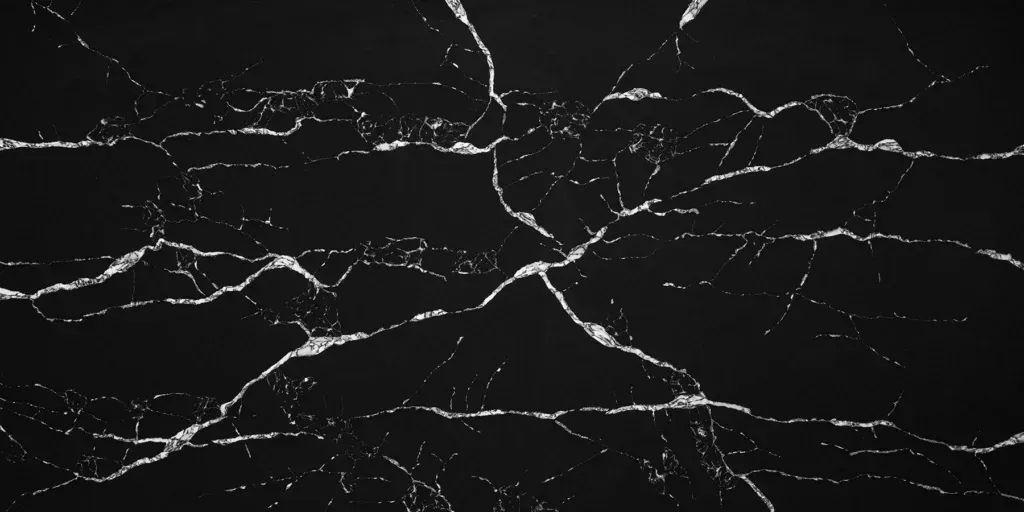Dark cracked glass with white fracture lines on a black background