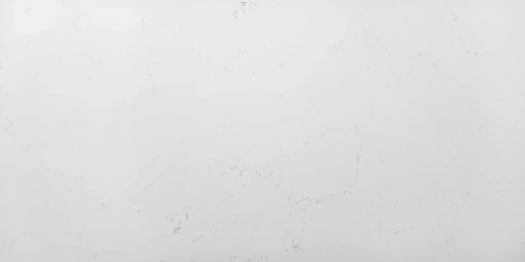 Light gray textured surface with faint speckles and small scattered marks