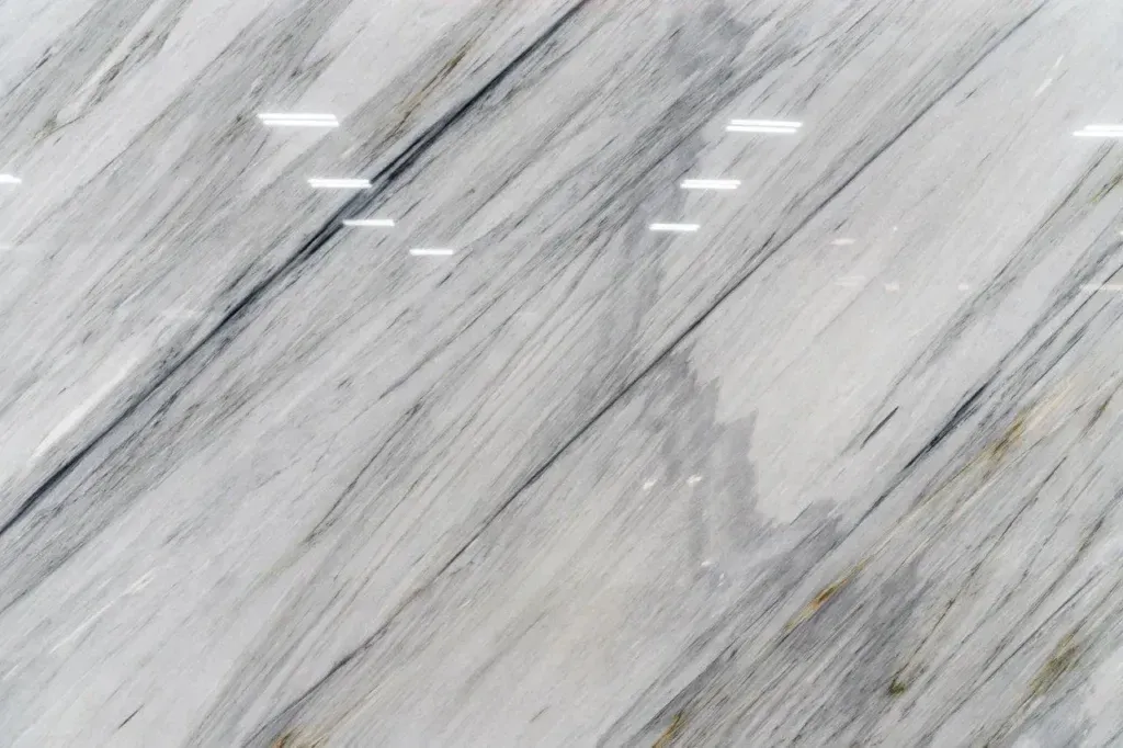 Light gray marble surface with subtle white veining and streaks