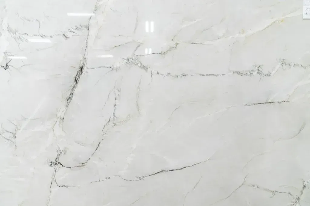 White marble surface with subtle gray veining and soft texture
