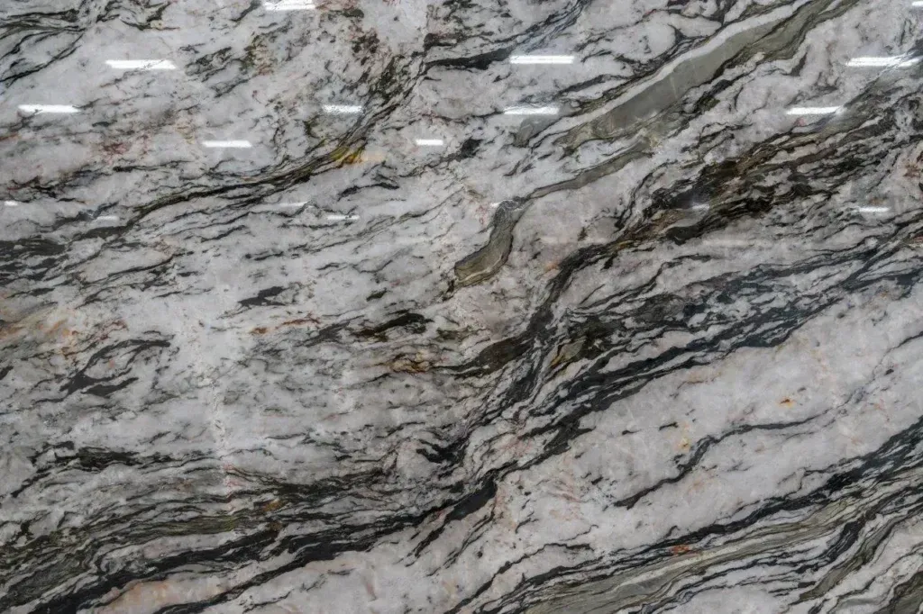 Gray and white marbled stone surface with dark veining