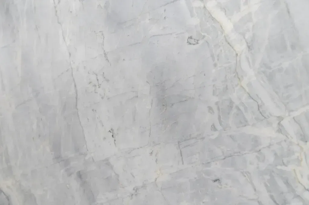 Light gray marble or stone surface with subtle veining and texture