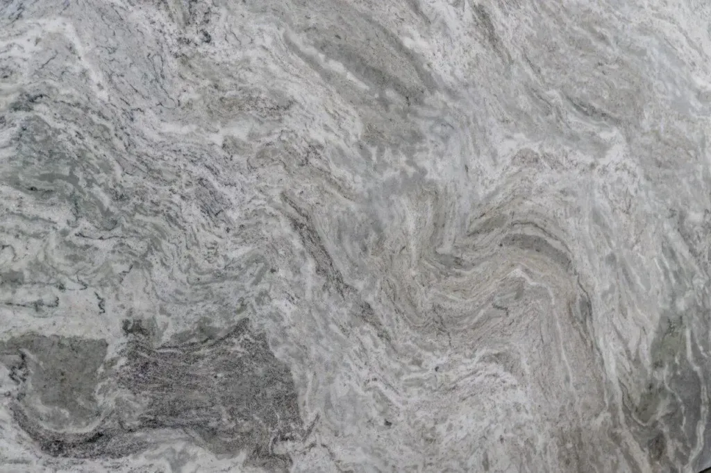 Gray marbled stone surface with swirling light and dark veining