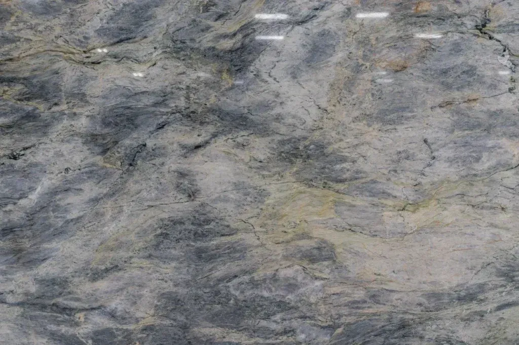 Gray and tan rocky surface with a rough, mottled texture