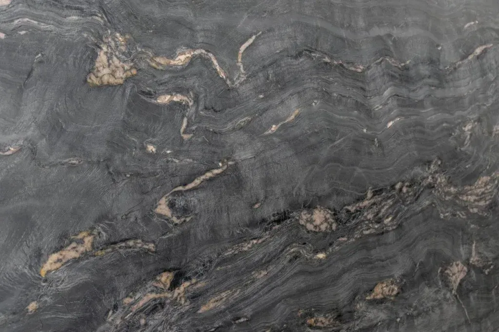 Gray marbled stone surface with subtle tan veining and wavy textures