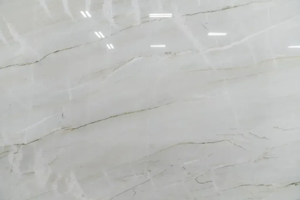 Light gray marble surface with subtle white veins and reflections