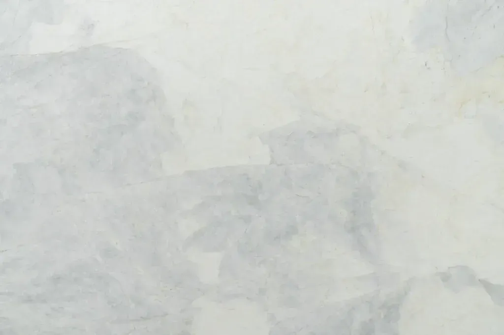 Abstract pale gray textured surface with faint cloudy patterns