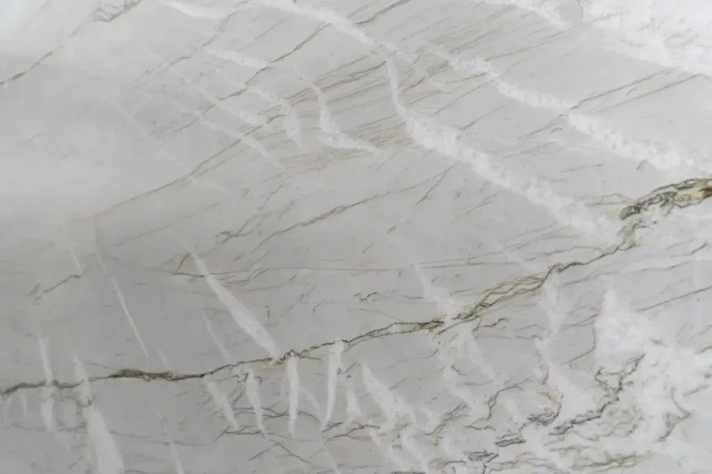Light gray marble surface with subtle white and tan veining