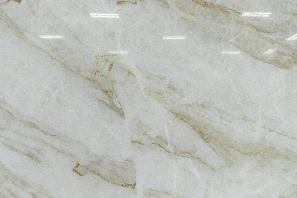 Light beige marble surface with subtle gold veining