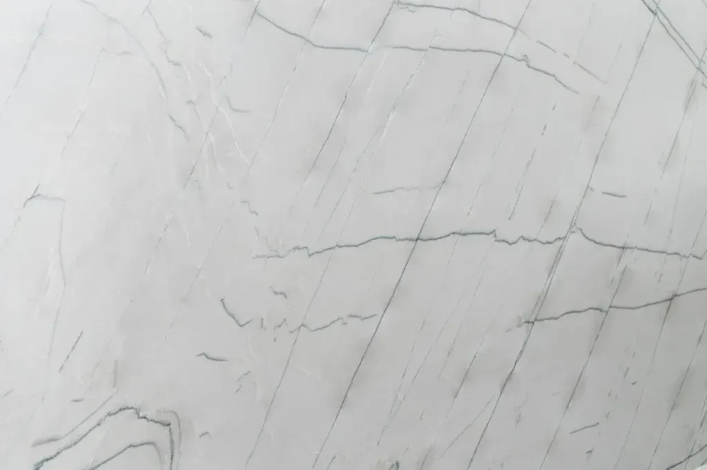 Light gray marble surface with subtle veining and cracks