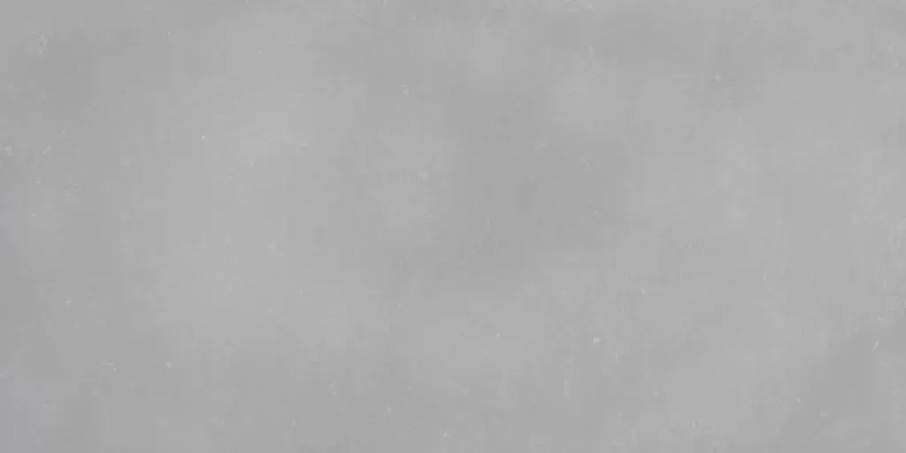Blurred gray surface with no distinct objects or subjects visible