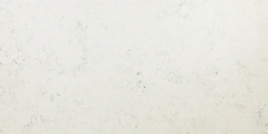 Light beige textured wall with subtle gray speckles