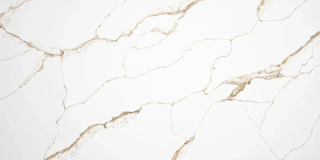 White marble surface with subtle gold veining and a glossy finish