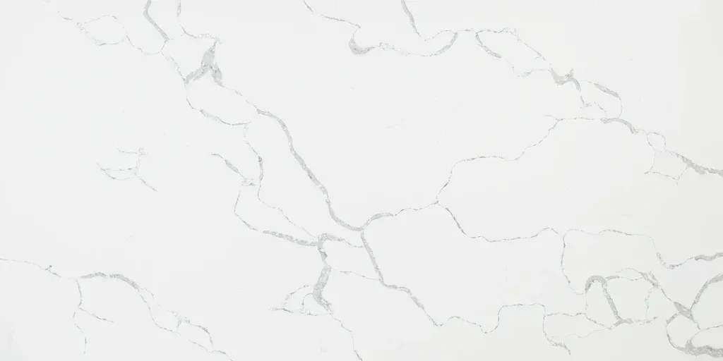 White marble or stone texture with faint gray veining on a light background