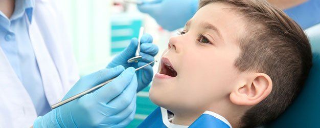 Dental examination on a boy