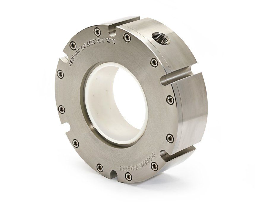 A close up of a stainless steel ring on a white background
