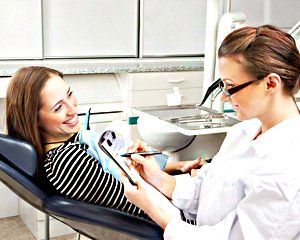 dental doctor with patient