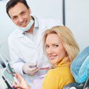 woman patient with dentist smiling