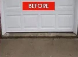 White garage door with concrete floor; red 