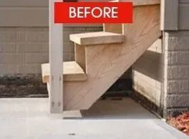 Wooden outdoor staircase against a building with concrete slab, red 