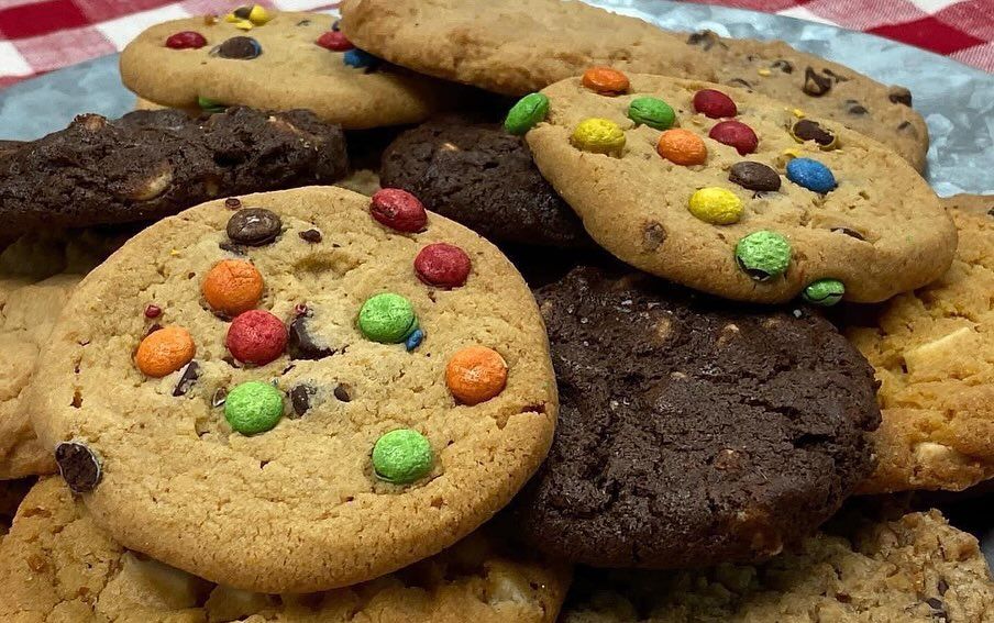 Cookies: chocolate chip, M&M, and other varieties piled on a platter.