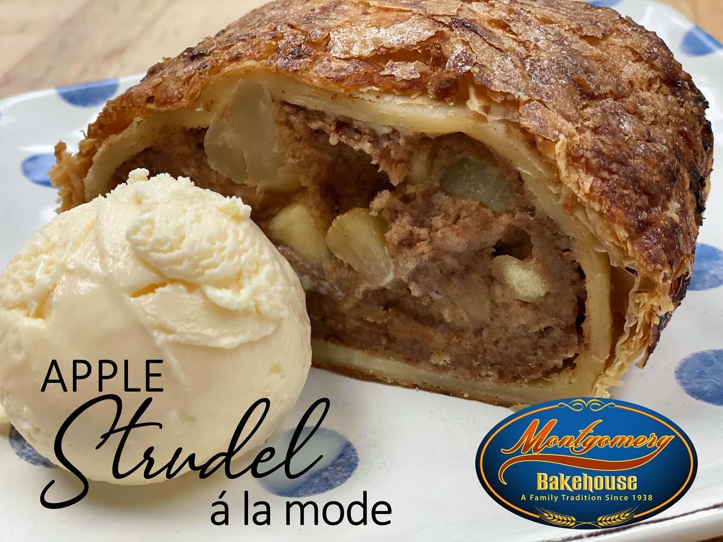 Apple strudel with vanilla ice cream, served on a blue-rimmed plate.