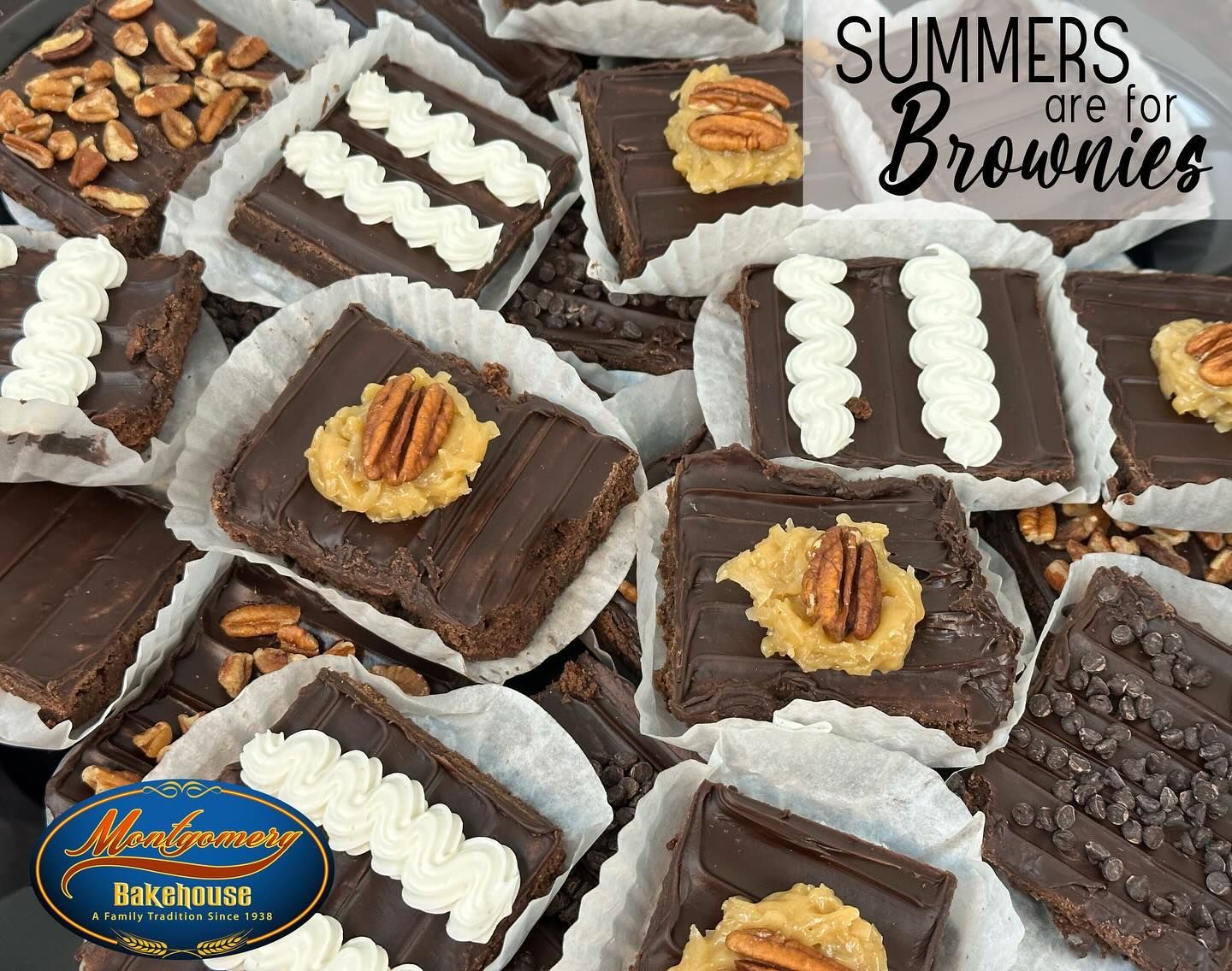 Brownies with chocolate frosting and various toppings on white paper in a container.