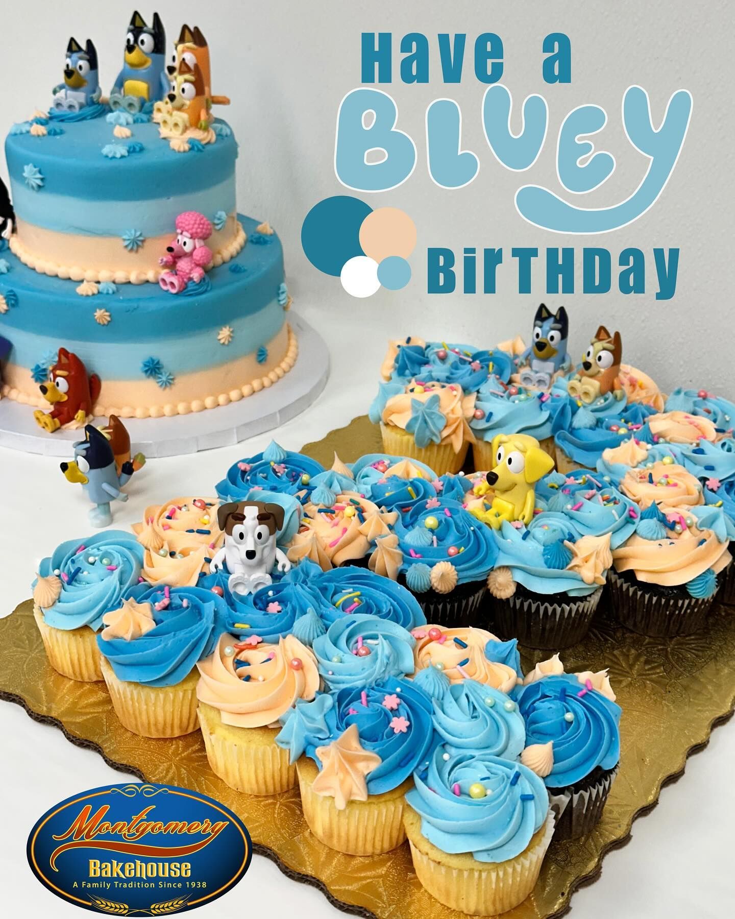 Bluey-themed birthday treats: cake and cupcakes with blue frosting, Bluey figurines, and 