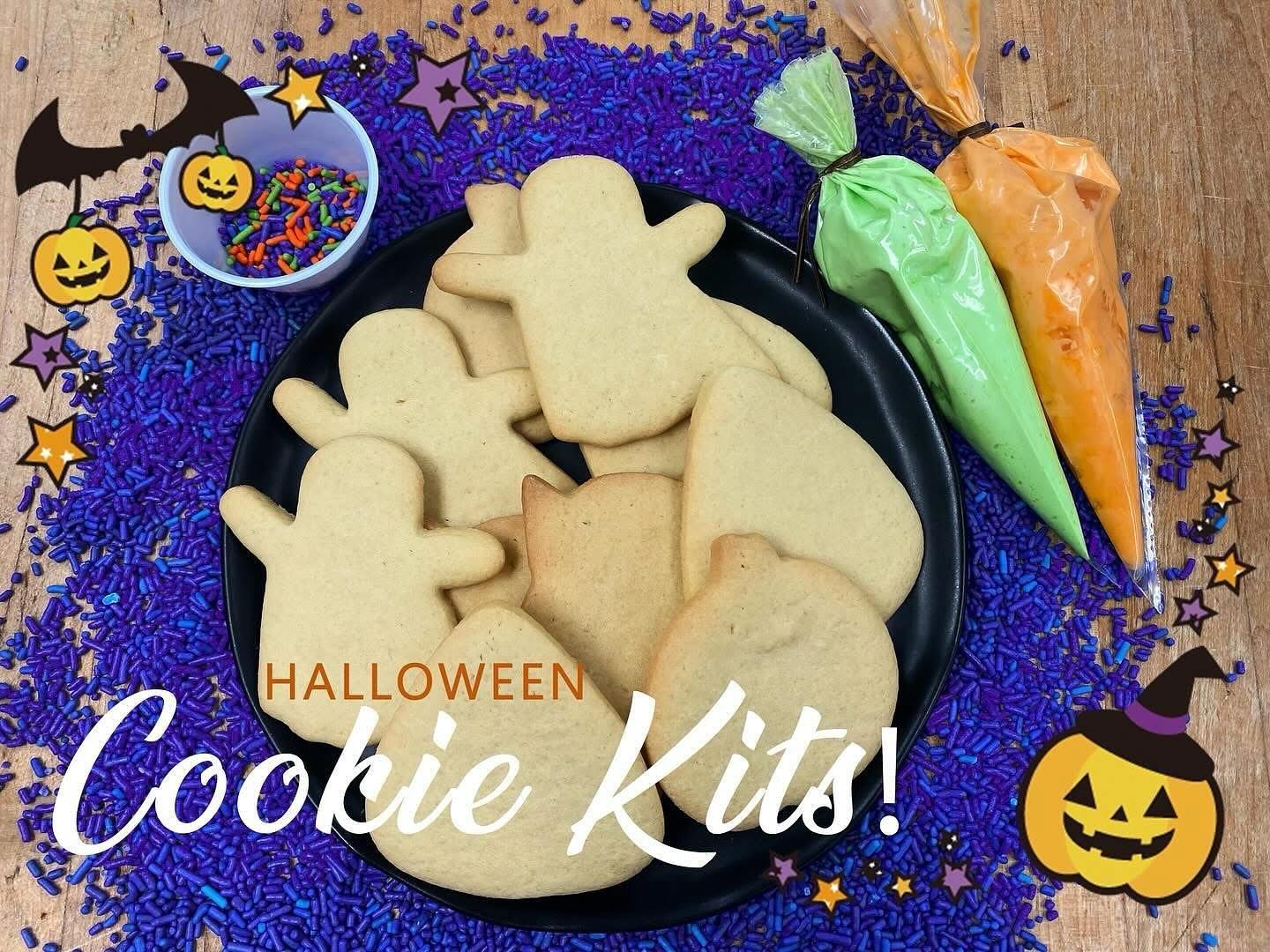 Halloween cookie decorating kit with ghost and pumpkin cookies, frosting, and sprinkles.