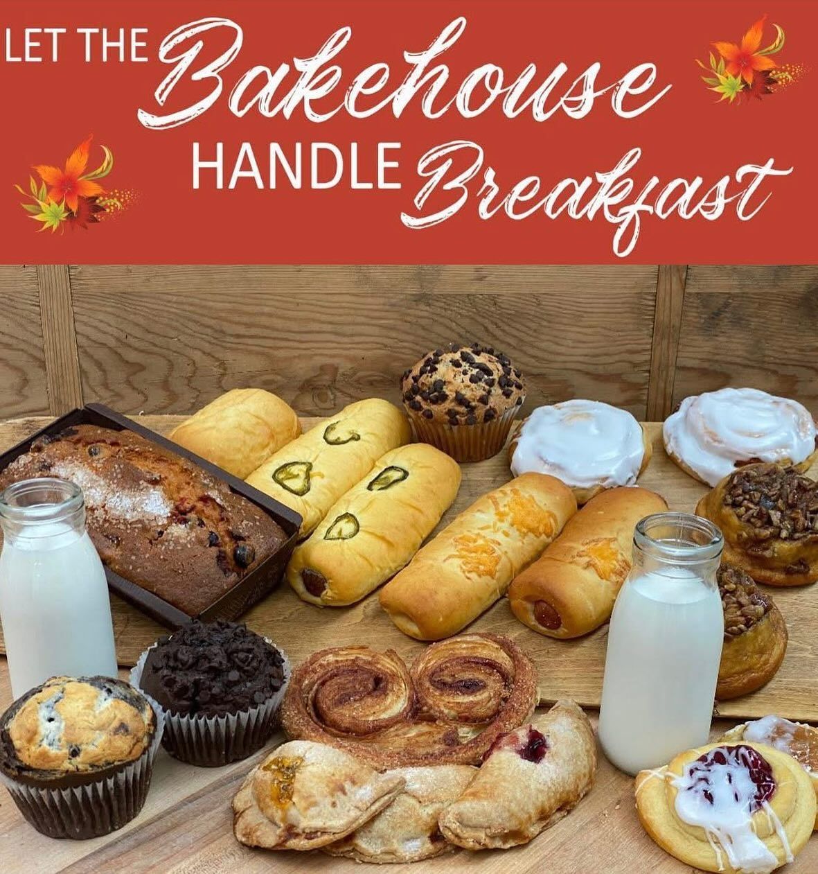 Breakfast pastries and milk bottles on a wooden surface.
