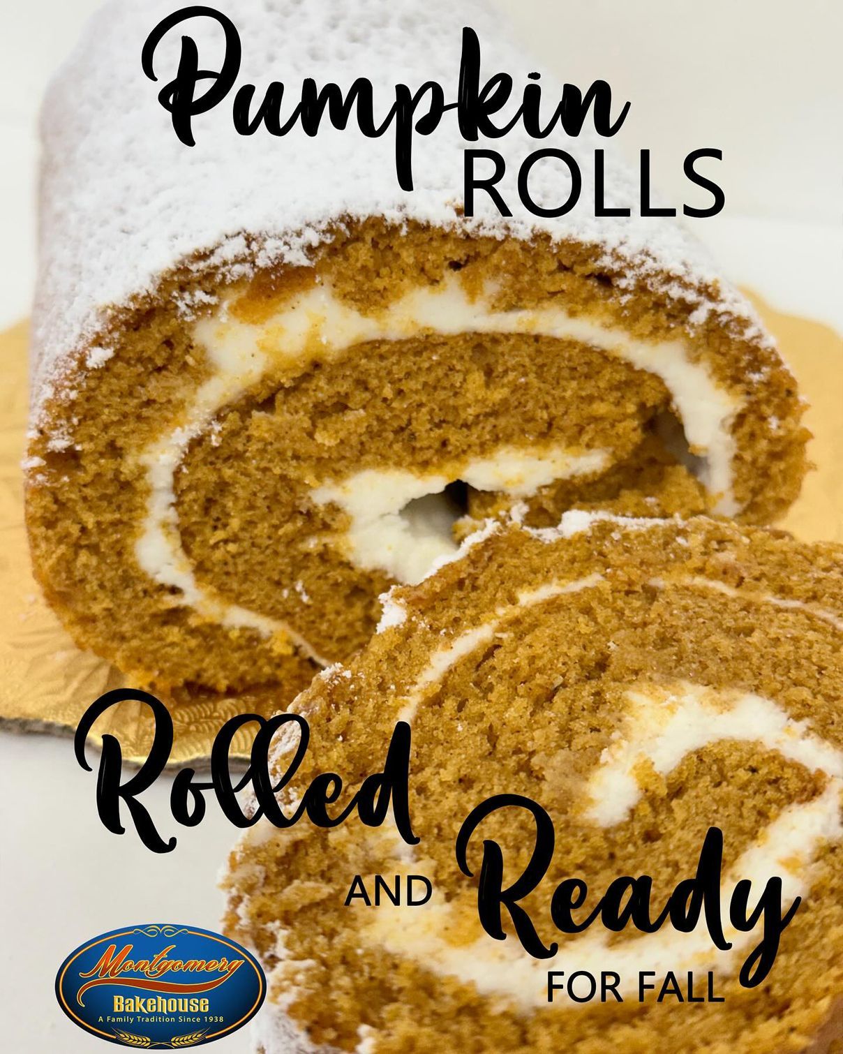 Pumpkin roll dessert, cut slices with cream cheese filling, dusted with powdered sugar.