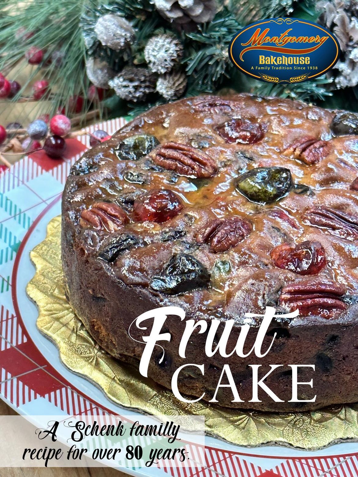 Fruitcake with pecans and candied fruit, on a festive plate, logo on top.