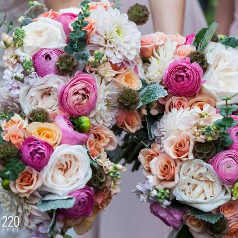 Two colorful bouquets with pink, white, and peach roses.