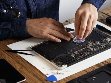 Man typing on a laptop