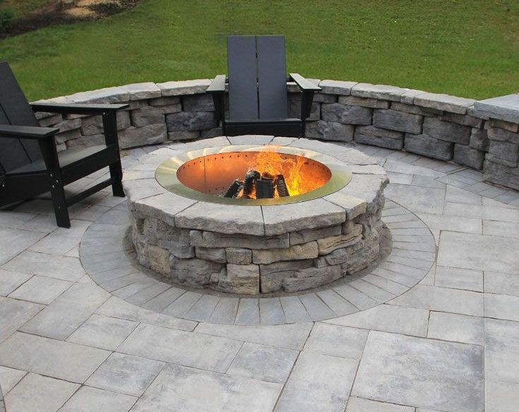 Burning round firepit on patio. Nicolock Belvedere firepit kit for sale in Lebanon PA.