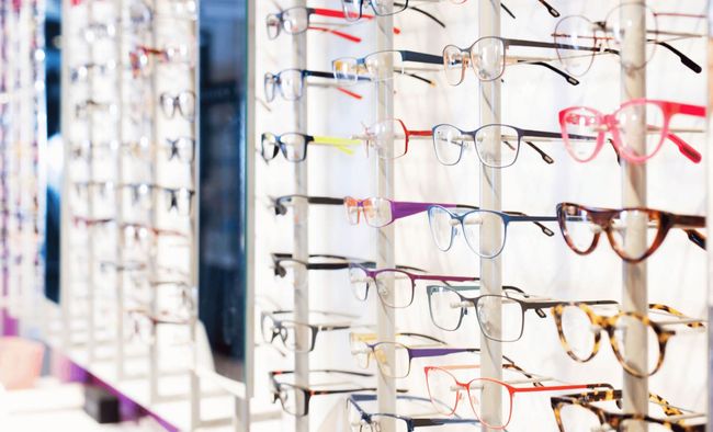 A row of glasses hanging on a rack