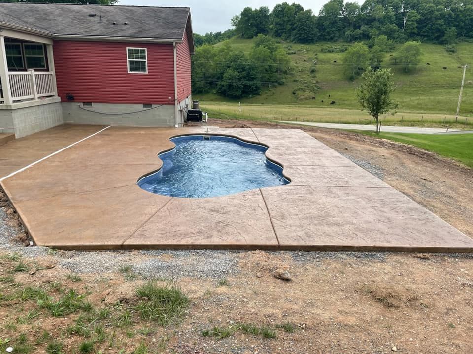 There is a swimming pool in the backyard of a house.