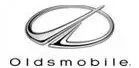 Oldsmobile logo: Silver oval with angled, stylized symbol and brand name below.