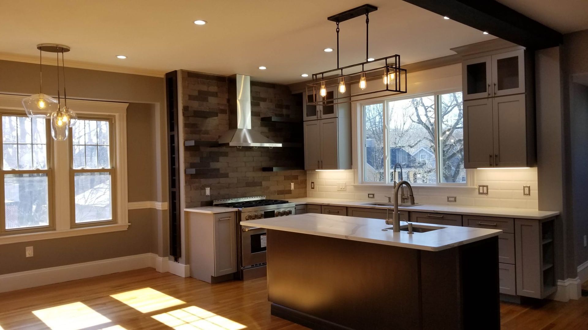 A kitchen with a large island in the middle of the room.