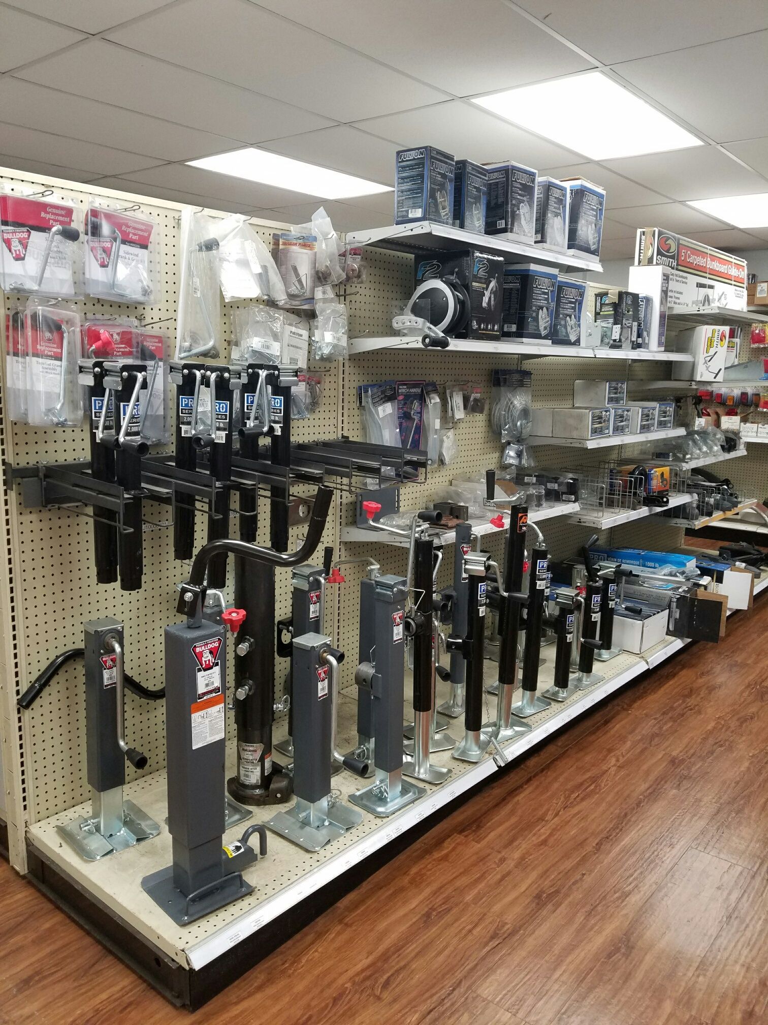 A store aisle filled with a variety of trailer parts.
