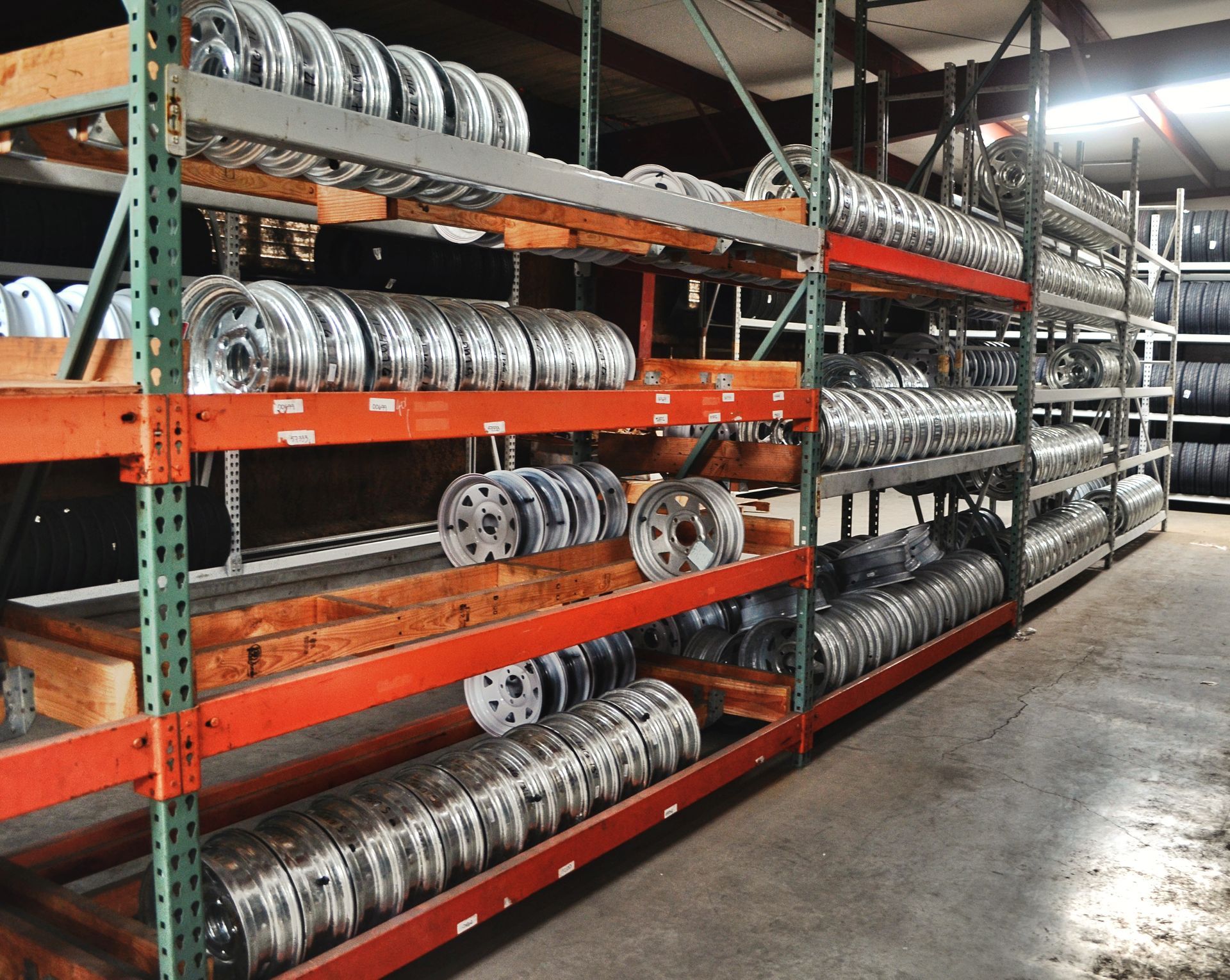 A warehouse filled with lots of wheels and tires
