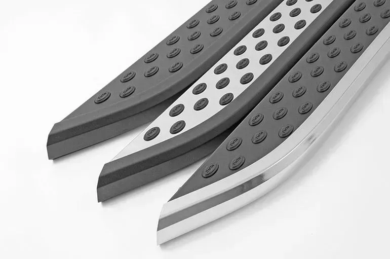 Three silver running boards with black non-slip surfaces, angled on a white background.