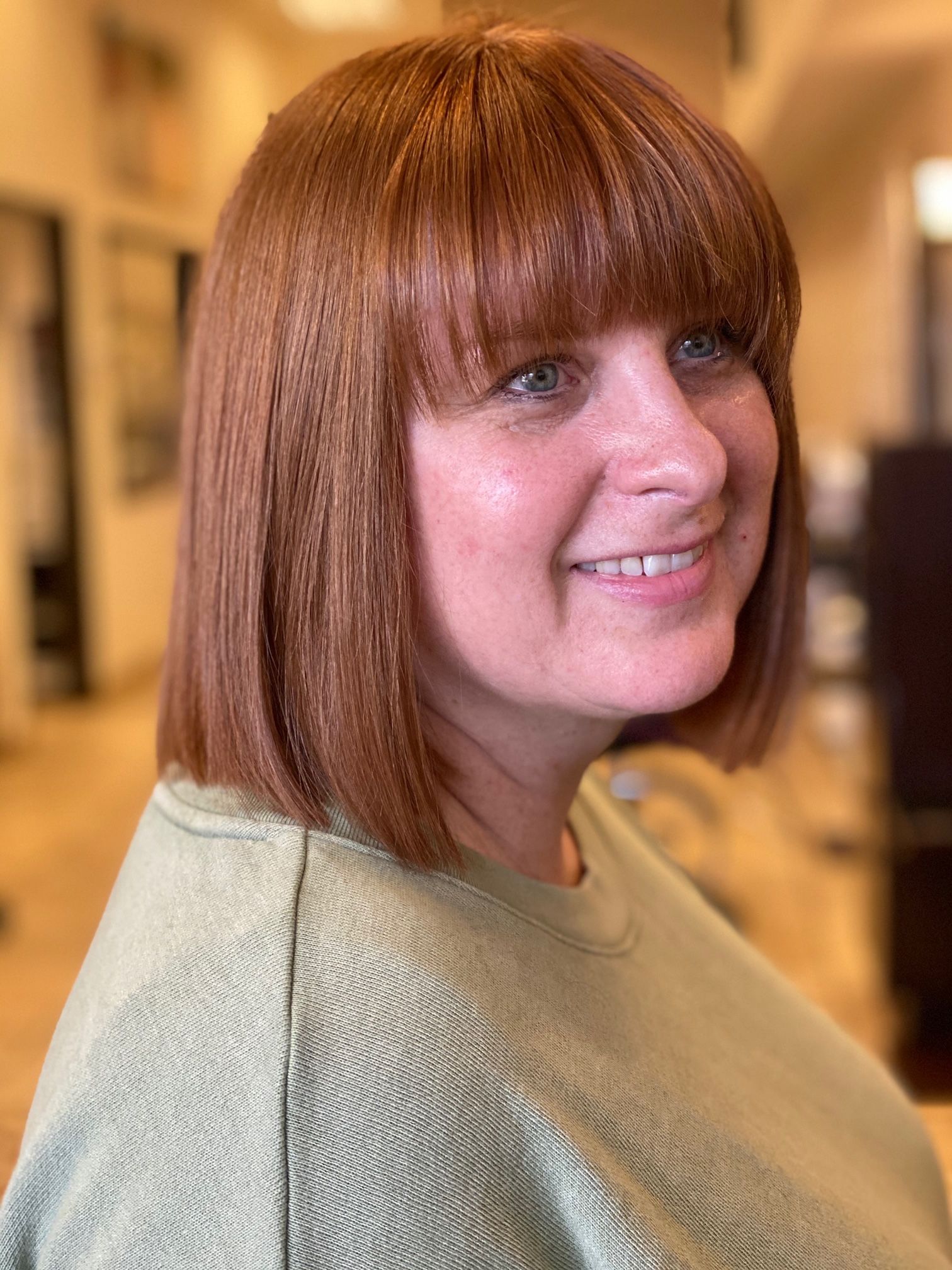 red hair bob with bangs haircut