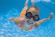 A girl kid underwater swimming pool.