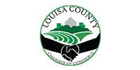 Louisa County seal with green farmland, trees, handshake, and curved text around the border